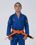 Kingz Comp V6 Youth BJJ Gi Blue - Upper Body Front View Teen Athlete Orange Belt HEAVY LIES THE CROWN Patch Crown Logo 450gsm