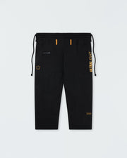 Kingz Legends Never Die Respect Women's Gi in Black – flat lay: black pants orange ULTRALIGHT text vertical right leg crown badge left thigh orange