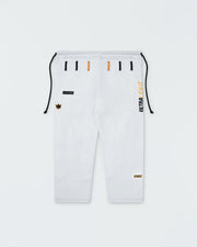 Kingz Legends Never Die Respect Women's Gi in White – flat lay: white gi pants black orange belt loops ULTRALIGHT text vertical KINGZ logo bottom