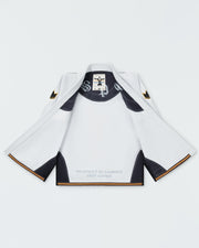 Kingz Legends Never Die Respect Women's Gi in White – open back view: inner lining black text "Respect Is Earned Not Given" black panels gold trim