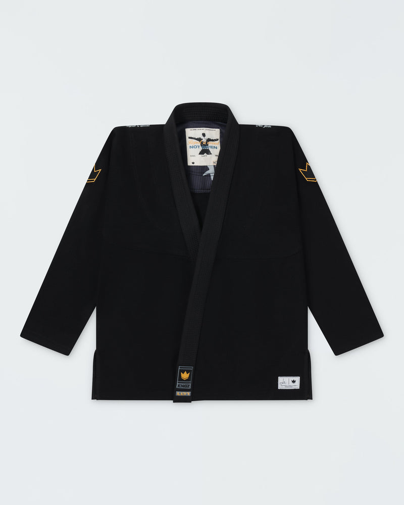 Kingz Legends Never Die Respect Women's Gi in Black – flat lay: black gi gold crown shoulder patches Kingz logo lapel tag white inner label