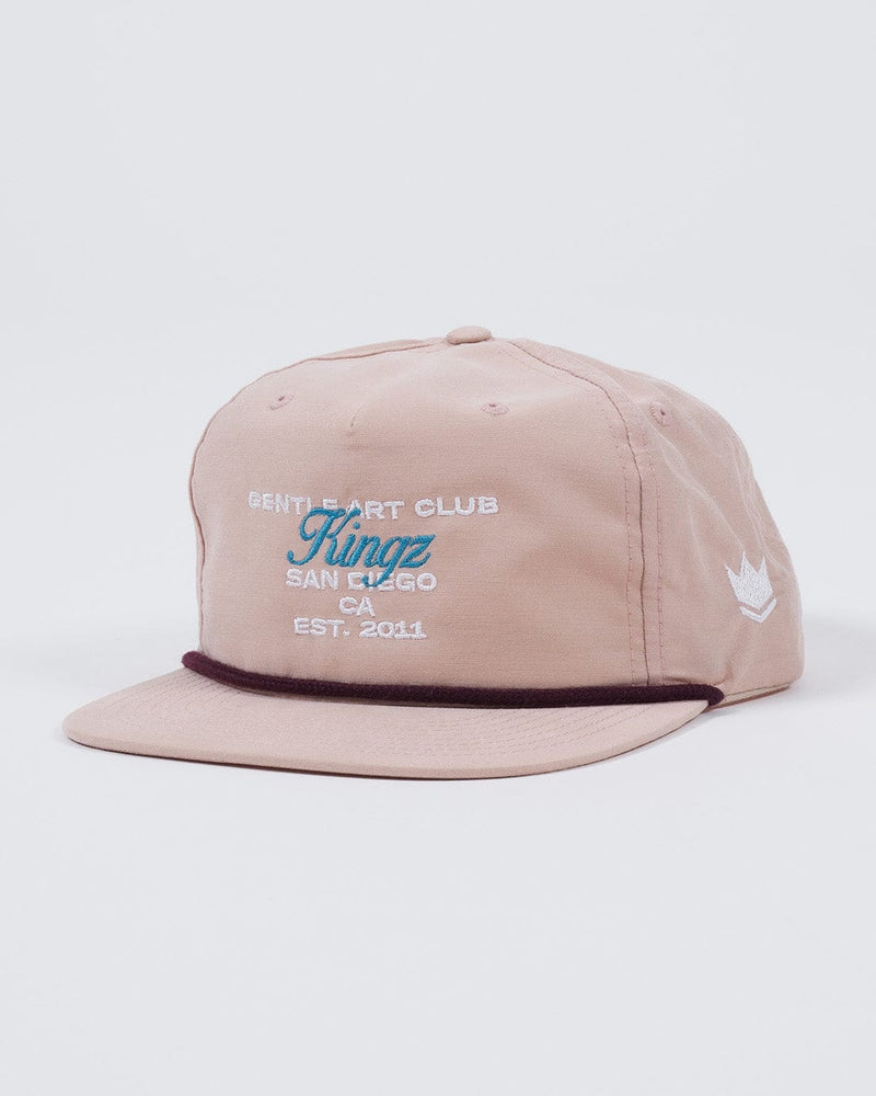 Kingz Gentle Art Club Snapback Peach - Angled View Embroidered Front Text Kingz San Diego CA EST. 2011 White Crown Side Logo Dark Trim Peach Hat Casual BJJ Apparel [color:Peach]