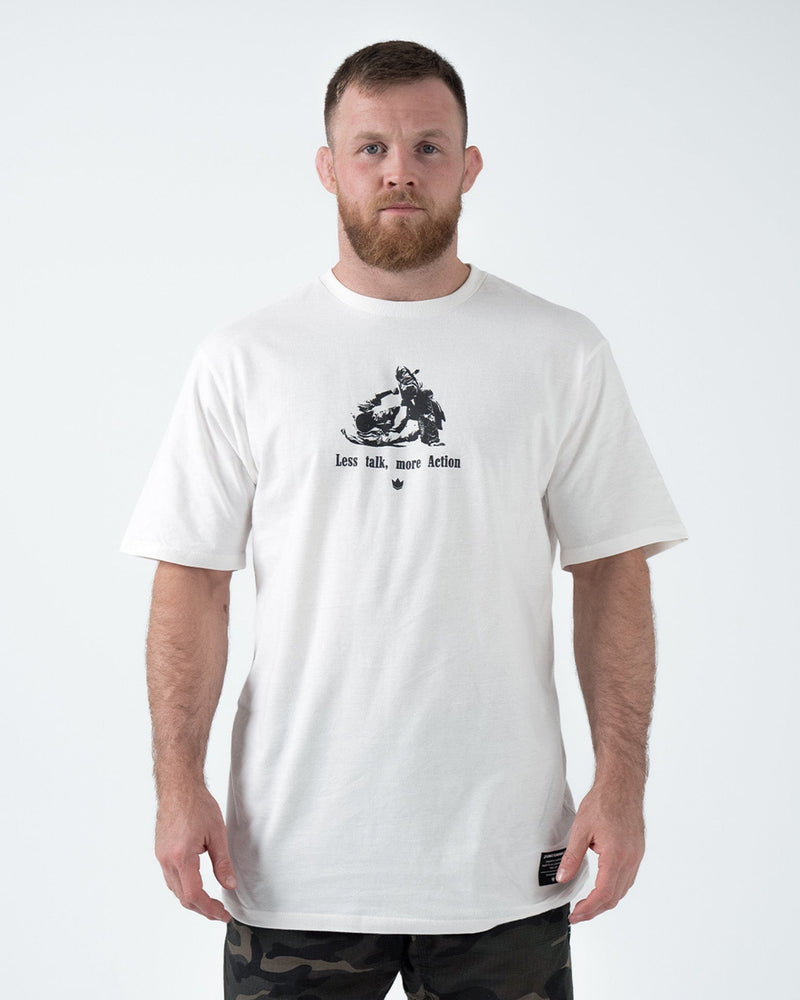 Kingz Less Talk Tee Black - Full Body Front View Male Athlete Black T-Shirt White Graphic Text "Less talk, more Action" Center Chest Comfortable Fit BJJ Training Apparel [color:Black]