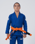 Kingz The ONE V2 Kids BJJ Gi - Blue - Full Body Front View Youth Athlete Blue Gi White Crown Logos Orange Belt Embroidered Patches Durable Fabric BJJ Training Gi [color:Blue]