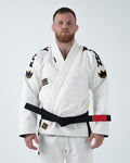 Kingz Comp 450 V6 Gi - White - Front View Male Athlete Black Belt Gold Crown Shoulder Patches Black KINGZ Text Sleeves Embroidered Logo Chest Durable Weave Jiu Jitsu Gear [color:White]