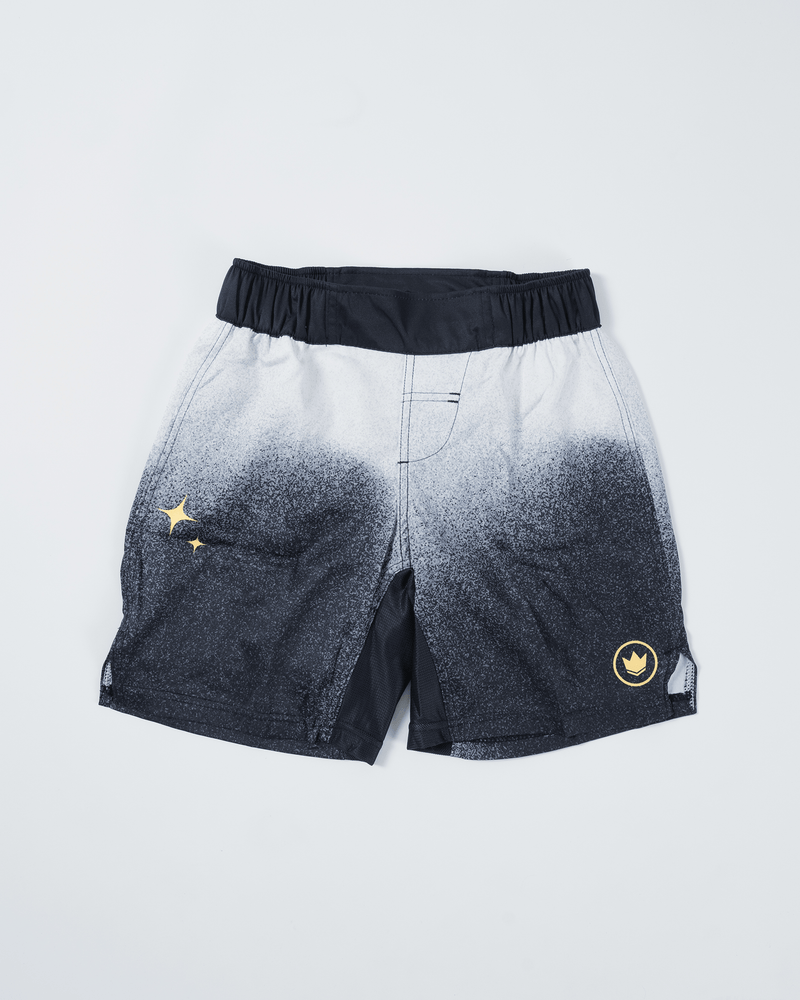 Kingz Galaxy Youth Shorts Black White - Flat Lay Product Shot Galaxy Gradient White Top to Black Bottom Speckle Pattern Gold Star Sparkles Left Side Gold Circular Crown Badge Right Side Black Waistband Kids Grappling Shorts No-Gi BJJ [color:Black/Galaxy]