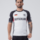 Kingz Jersey Rashguard - Deutschland White - Full Body Front View Male Athlete Black Sleeves Red Side Panels DEUTSCHLAND Text German Flag Chest Crown Badge BJJ No-Gi Training