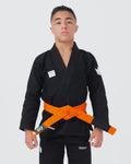 Kingz Kore V2 Youth BJJ Gi Black - Upper Body Front View Teen Athlete Orange Belt Crown Logo KINGZ Patch 380gsm Youth