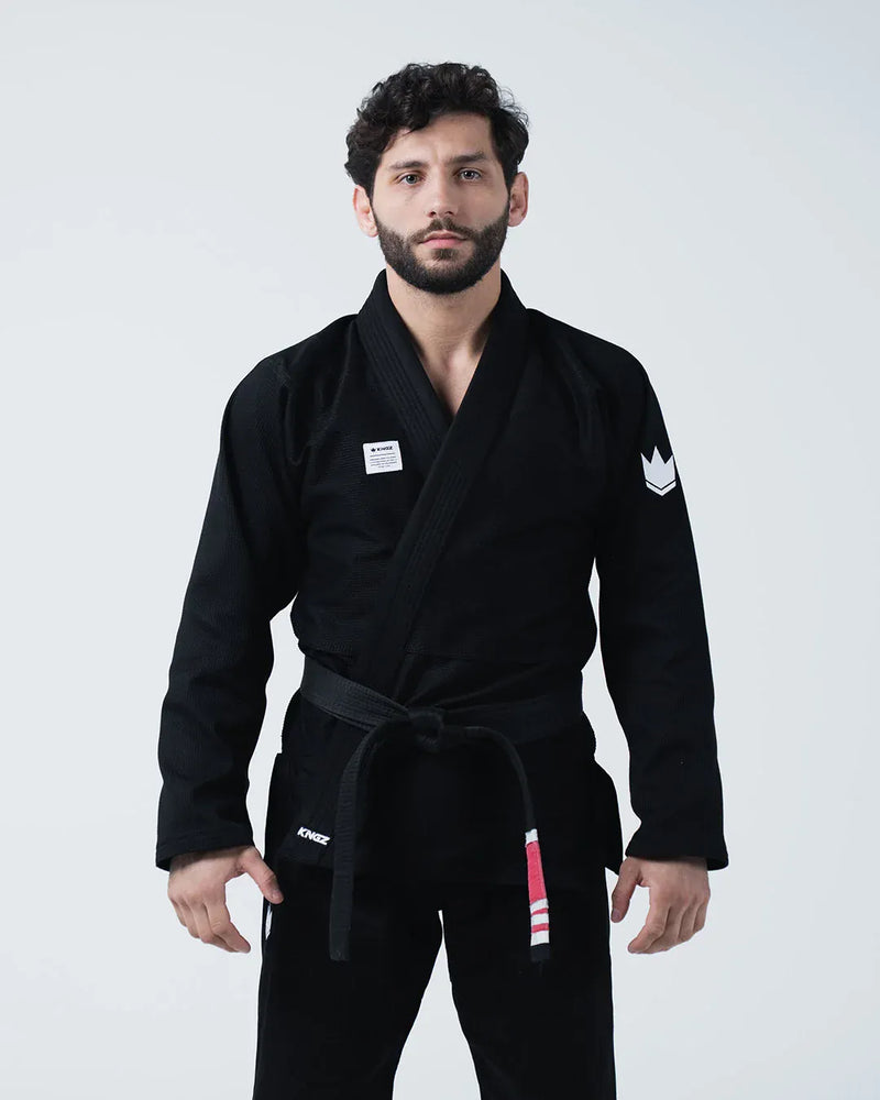 Kingz Kore V2 Jiu Jitsu Gi - Black - Front View Male Athlete Black Gi White Crown Shoulder Patch Kingz Logo Waist Black Belt BJJ Training Gi [color:Black]
