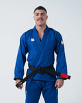 Kingz Kore V2 Jiu Jitsu Gi - Blue - Full Body Front View Male Athlete Solid Blue Gi White Crown Sleeve Patch Black Belt Contrast Red Tab BJJ Training Gi [color:Blue]