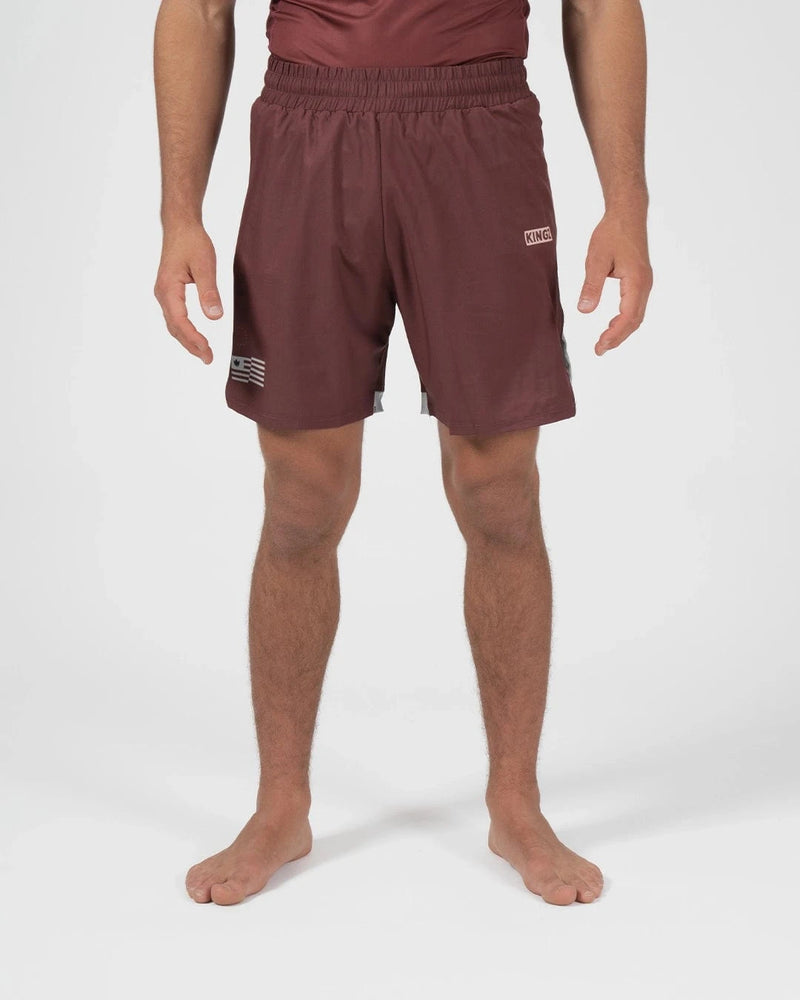 Kingz Trooper Shorts Maroon - Full Body Front View Male Athlete Maroon Burgundy Color KINGZ Badge Right Thigh Flag Badge Left Leg Inner Compression Shorts Gray Trim Competition Cut Men's Grappling Shorts No-Gi BJJ [color:Maroon]