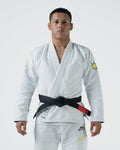 Kingz MI-K Roots Gi - White - Full Body Front View Male Athlete Yellow Crown Badge Sleeve Black Belt Contrast Stitching MI-K ROOTS Text Lapel Tag BJJ Gi Training [color:White]