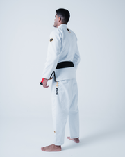 Kingz Legends Never Die Respect Gi in White – back view on male model: black belt crown badge shoulders gold text ULTRA LIGHT side pants