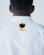 Kingz Legends Never Die Respect Gi in White – back view: close-up black crown badge yellow embroidery textured fabric collar