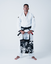 Kingz Legends Never Die Respect Gi in White – full body front view on male model: white gi black tote bag graphic crown badge shoulders black belt