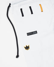 Kingz Legends Never Die Respect Youth Gi in White – close-up detail view: black drawstring black and orange belt loops crown badge embroidery Legends