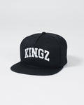 Kingz Slice Snapback - Black - Angled Front View Black Hat Bold White KINGZ Text Flat Brim Structured Crown Embroidered Logo Casual Streetwear BJJ Training Apparel [color:Black]