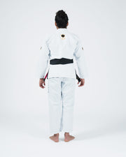 Kingz Legends Never Die Respect Women's Gi in White – full body back view on female model: black crown badge upper back black belt white gi