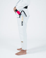Kingz Legends Never Die Respect Women's Gi in White – side view on female model: black belt pink sleeve trim black waistband ULTRALIGHT vertical text