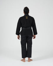 Kingz Legends Never Die Respect Women's Gi in Black – full body back view on female model: yellow crown logo upper back embroidered side pants