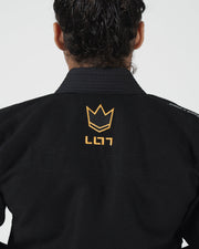 Kingz Legends Never Die Respect Women's Gi in Black – back view: close-up orange crown logo textured fabric