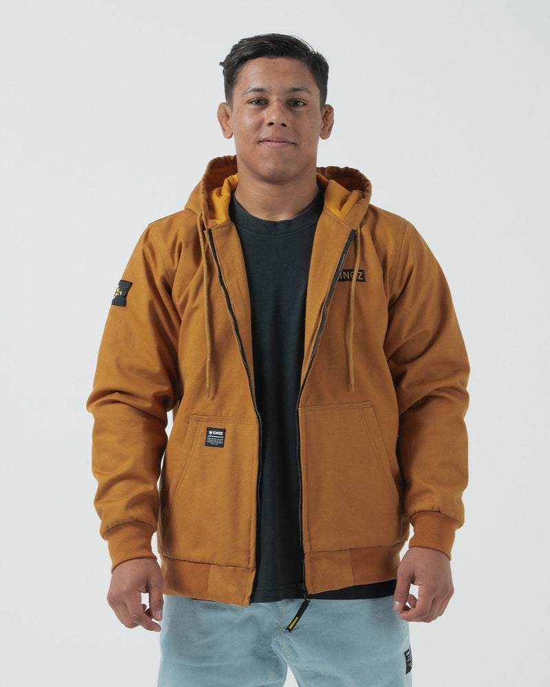 Kingz Canvas Jacket Tan - Full Body Front View Male Athlete Tan Canvas Material KINGZ Chest Patch Black Arm Badge Ribbed Cuffs Hem Streetwear Casual Urban Style [color:Black]