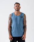 Kingz Game Changer Tank Blue - Full Body Front View Male Athlete Blue Tank Black Label Left Chest Tattooed Arms Relaxed Fit Streetwear [color:Blue]