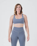 Kingz Kore Women's Sports Bra Smoke Blue - Full Body Front View Female Athlete White Crown Logo Left Chest Racerback Design Seamless Fit BJJ Training Sports Bra [color:Steel Blue]
