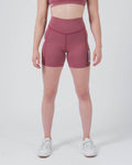 Kingz Kore Women's Training Shorts Red Dusty Rose - Full Body Front View Female Athlete Dusty Rose Mauve Biker Style Short Cut High-Waist Wide Waistband KINGZ White Text Right Thigh Matching Mauve Sports Bra White Sneakers Women's Training Shorts No-Gi BJJ Kore Collection [color:Dusty Rose]