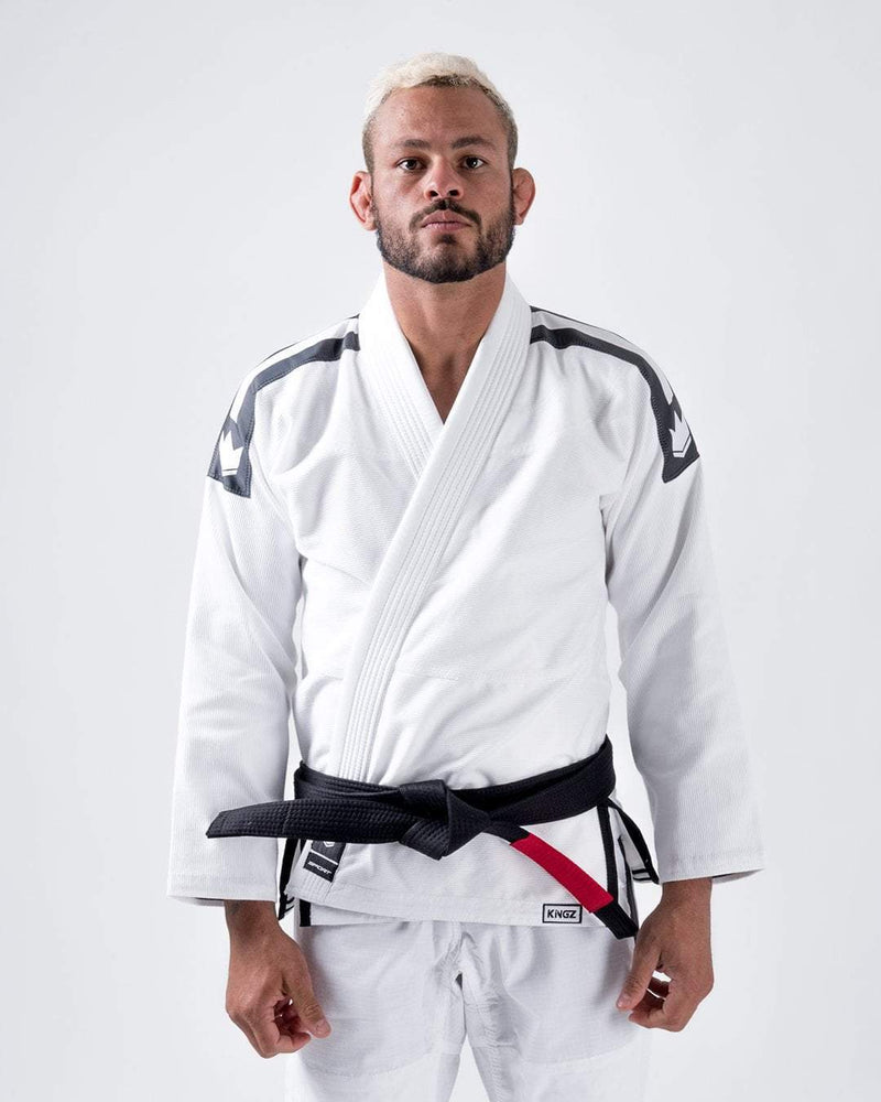 Kingz Sport Jiu Jitsu Gi White - Front View Male Athlete Black Shoulder Patches Crown Badge Black Belt Kingz Logo Hem Durable Fabric Traditional Fit BJJ Gi Training [color:White]