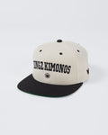 Kingz Collegiate Snapback White/Black - Angled View Cream Crown Black Brim KINGZ KIMONOS Bold Front Text Crown Logo Front Green Underbill Streetwear [color:Black]